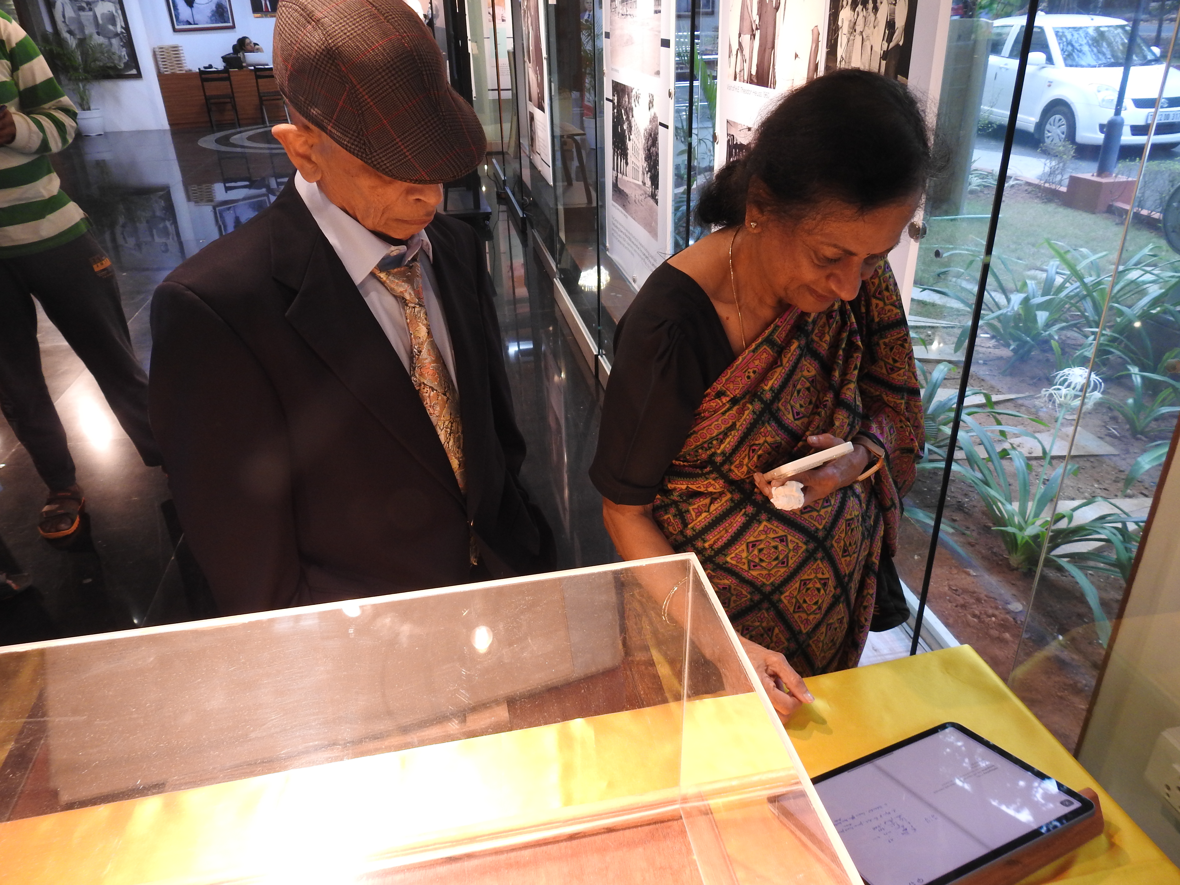 Mr. S. S. Mani Venkata and Mrs. Padma view the autograph book exhibit