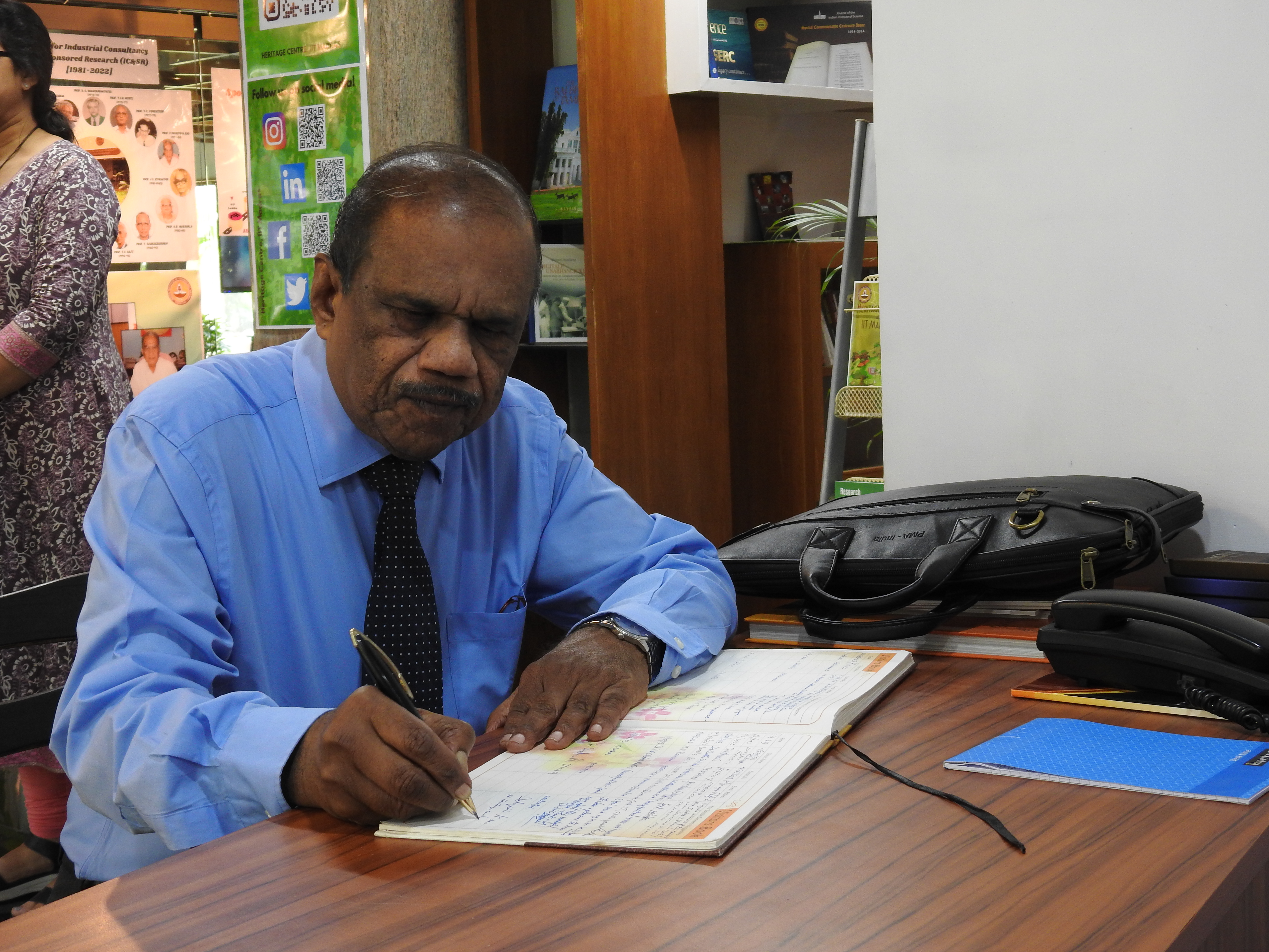 Dr. A. Sivathanu Pillai signs the Visitors' Book at the Heritage Centre