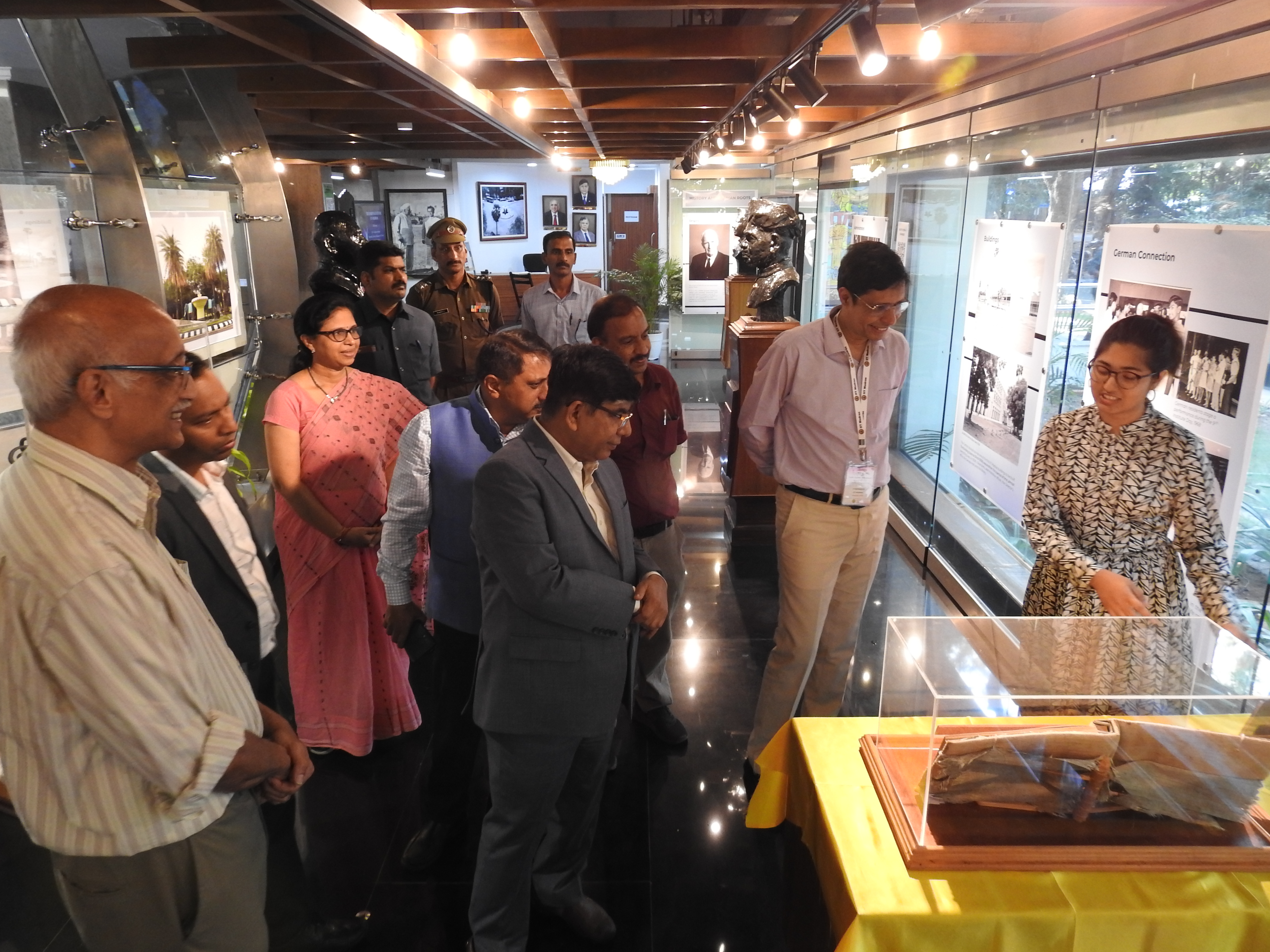 Ashlin Deena Mathews (Project Associate, Heritage Centre) shows Dr. Subhas Sarkar (Union Minister of State for Education) the Visitors' Book at the Heritage Centre