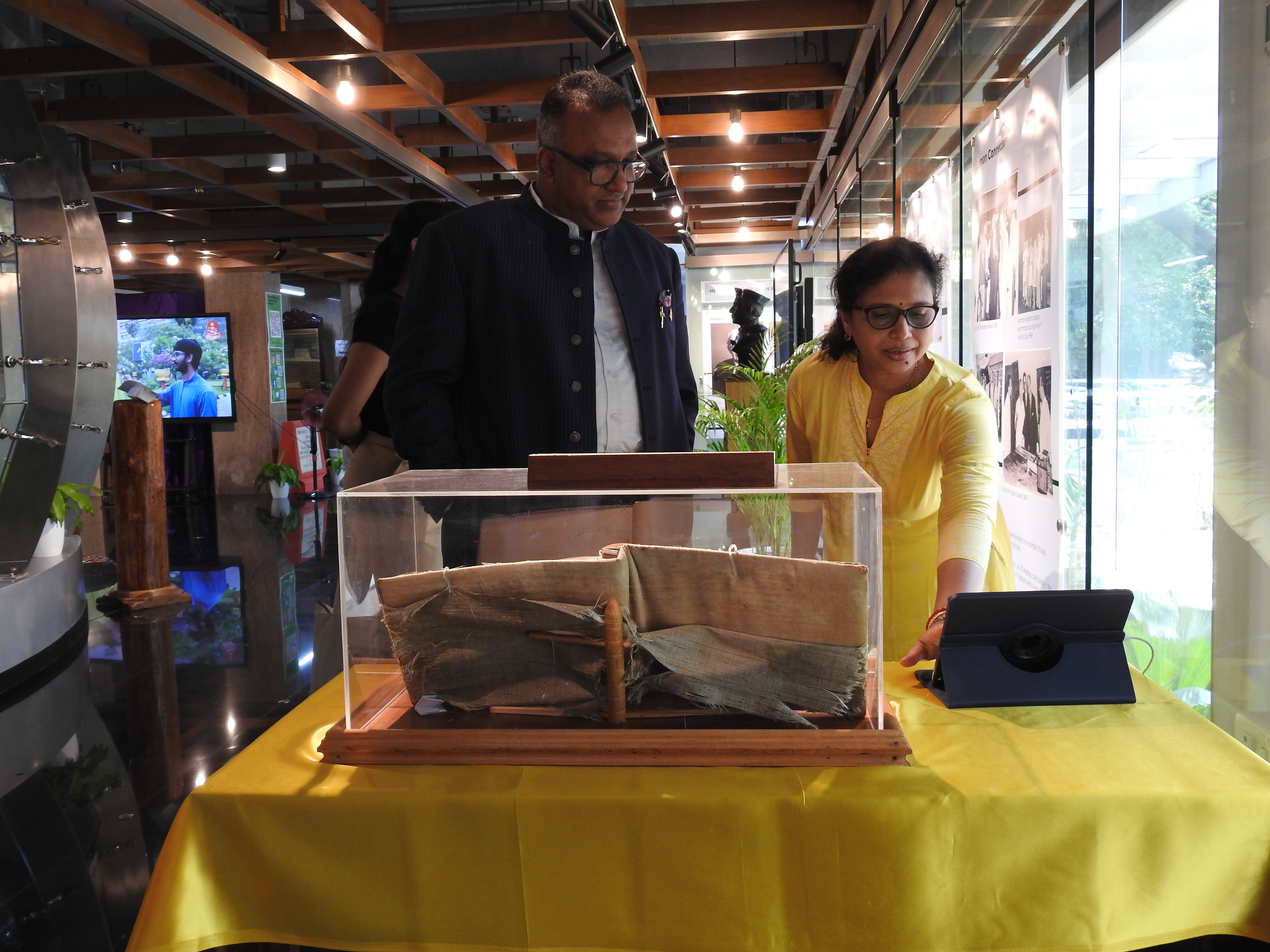 Ms. Mamata Dash shows Prof. Dr. C. Raj Kumar the autograph book exhibit
