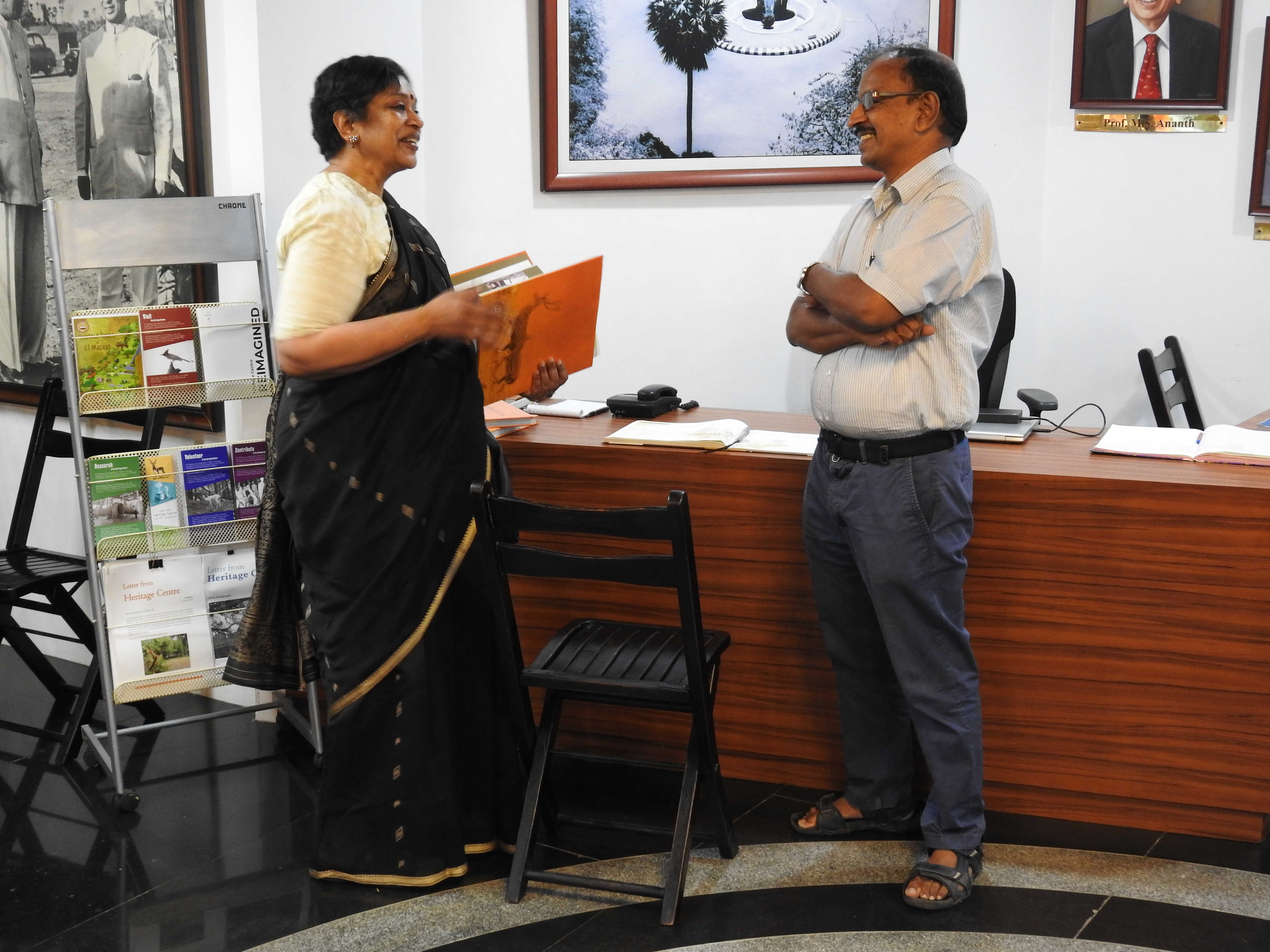 Kamini Dandapani receives a copy of Campaschimes from Kumaran Sathasivam (Operational Head of Heritage Centre)