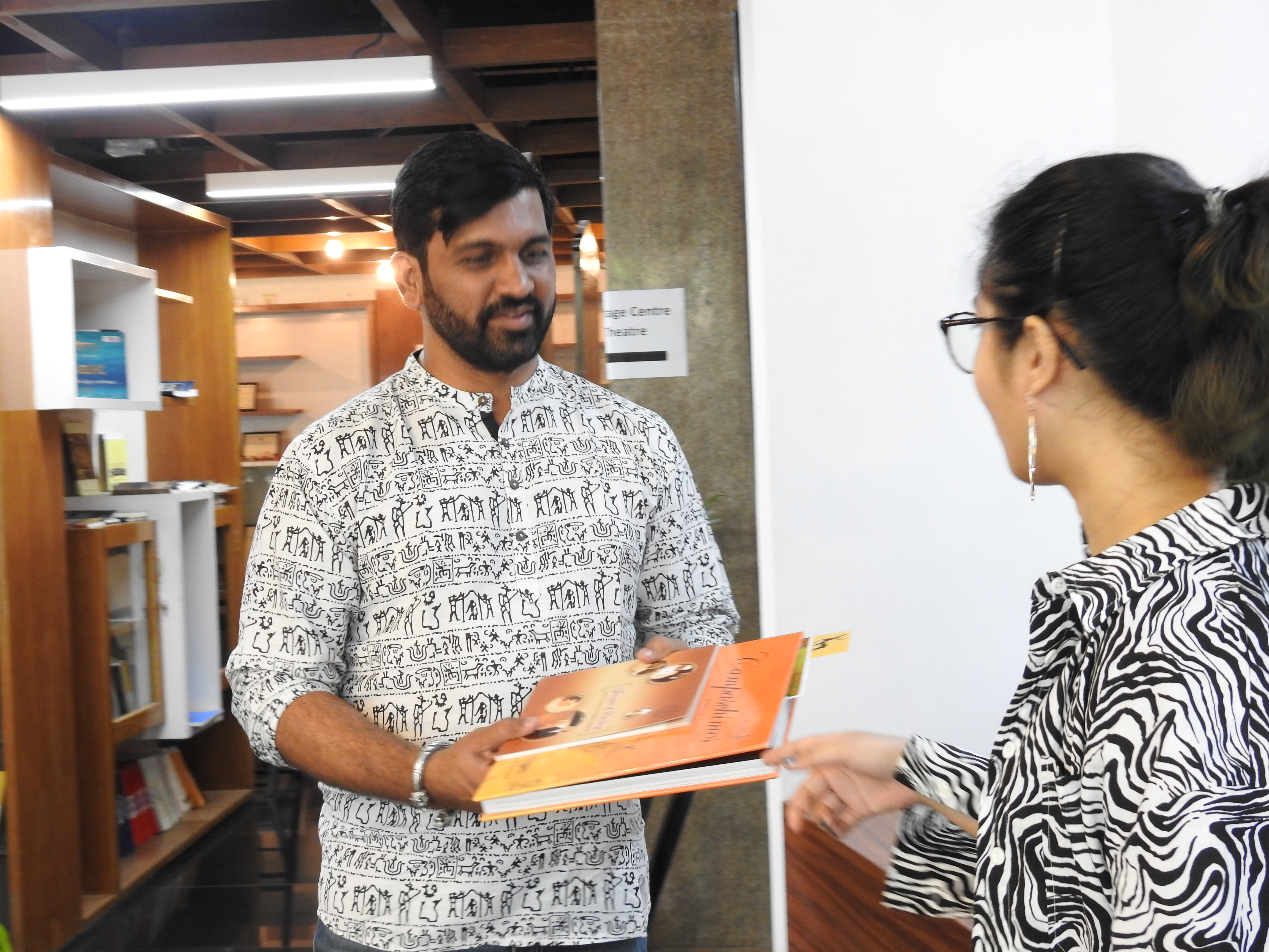 Digpal Lanjekar receives a copy of Campastimes