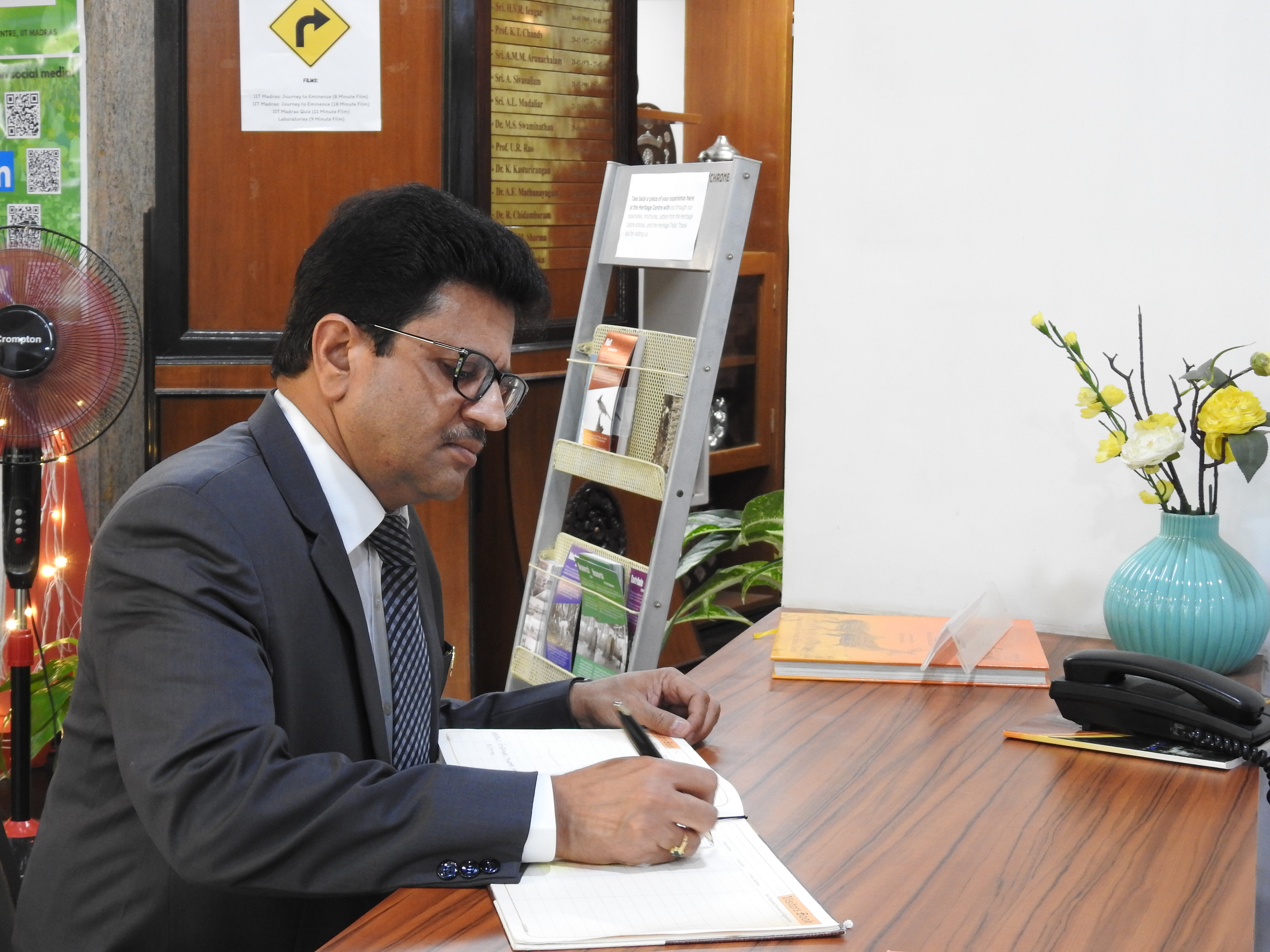 Mr. Arvind Kumar signs the Visitors' Book at the Heritage Centre
