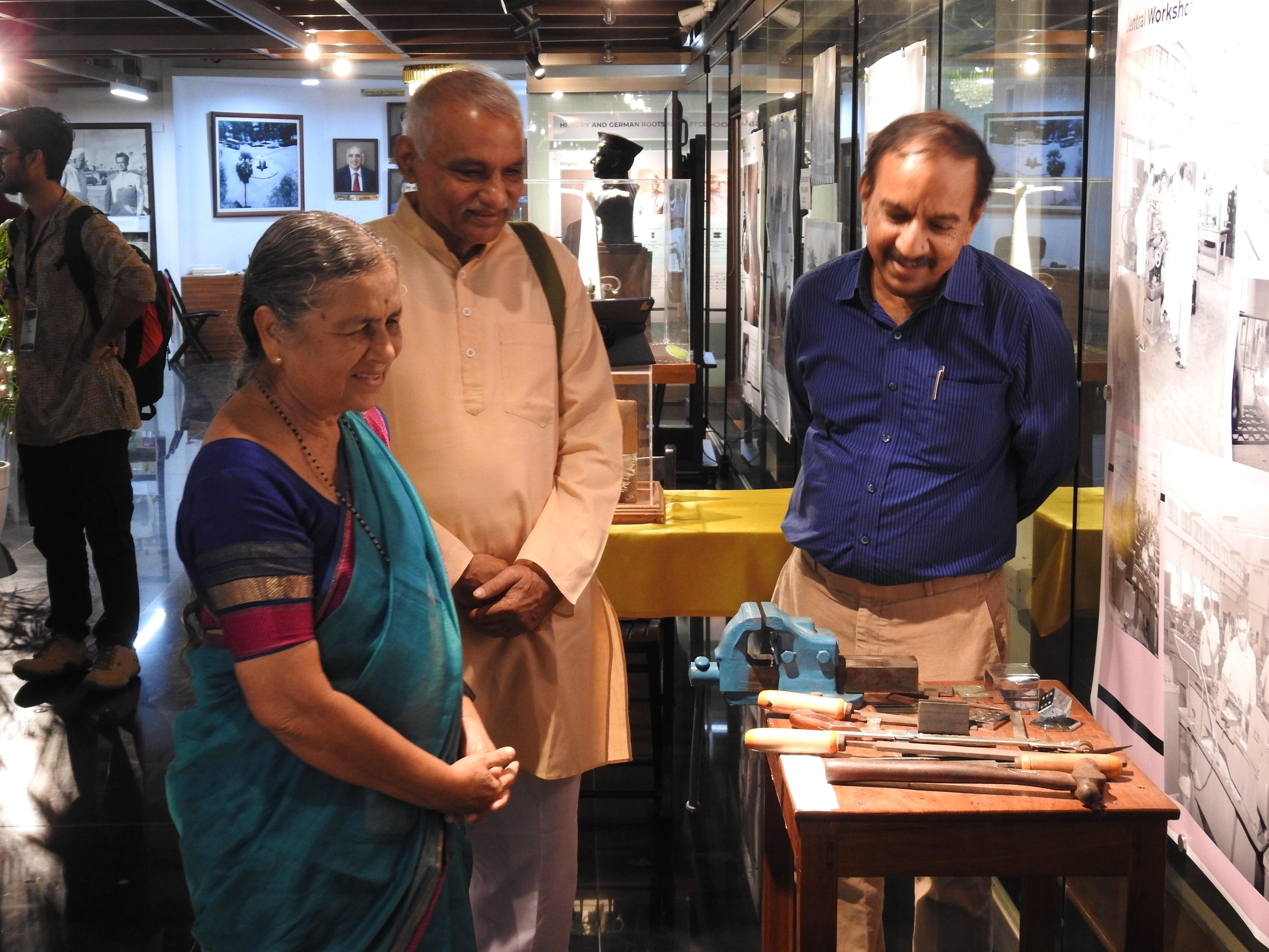 Mr. Kumaran Sathasivam (Operational Head of Heritage Centre) showing the model of the workshop bench to Mr. Prakash and Mrs. Mandakini Amte