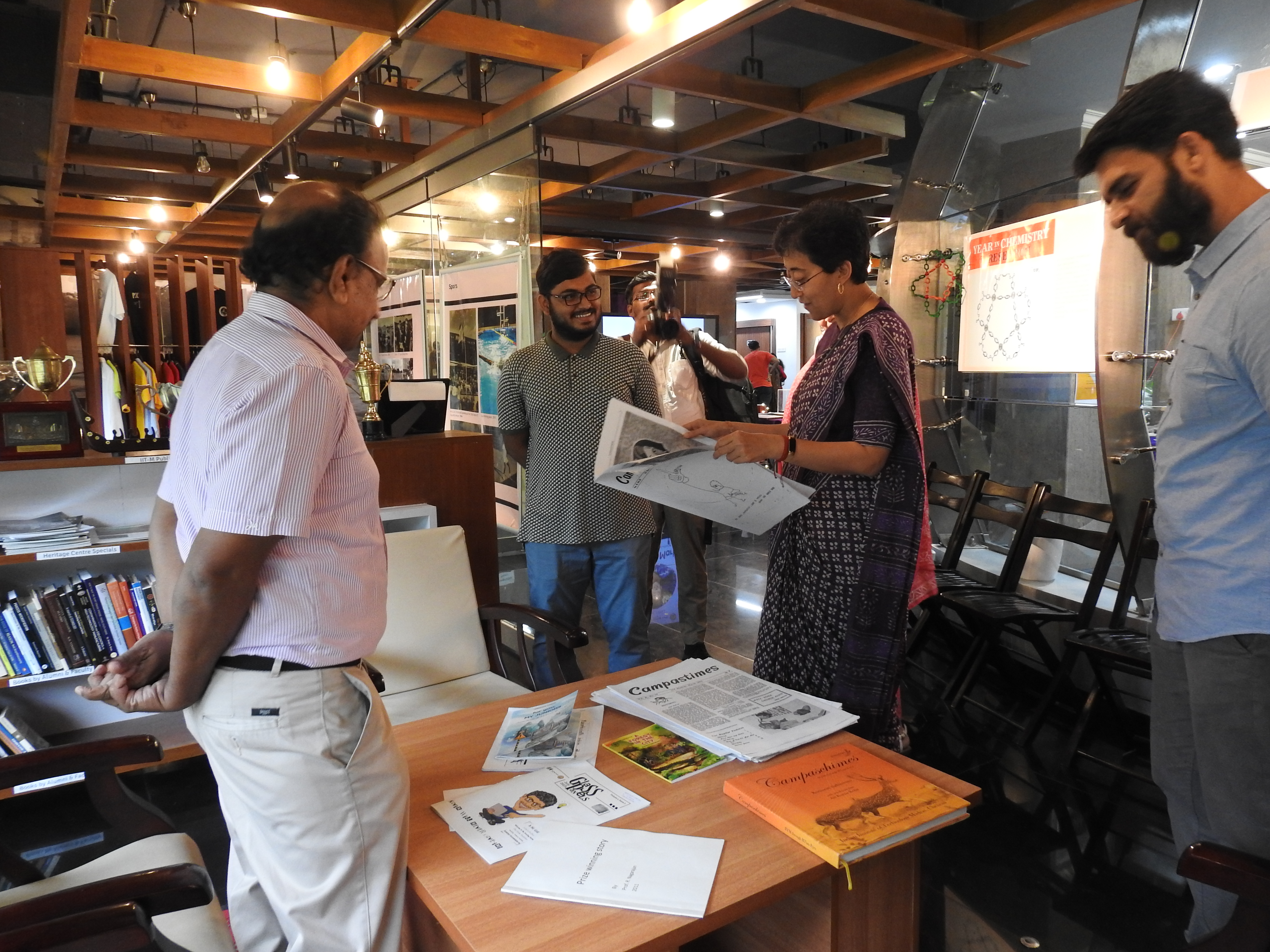 Atishi takes a look at an issue of Campastimes in the Reading Room of the Heritage Centre