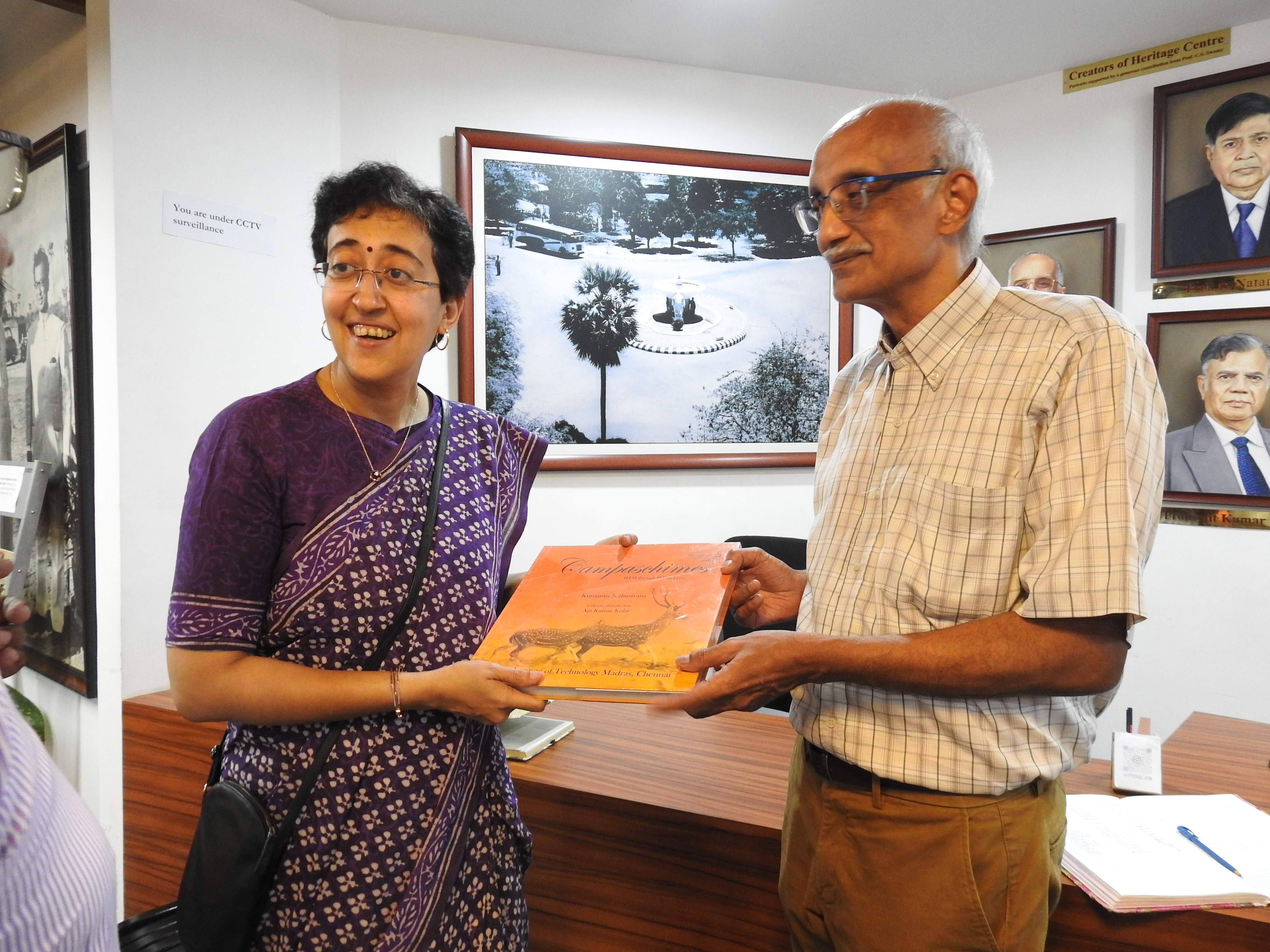 Prof. R. Nagarajan (Professor-in-charge of the Heritage Centre) presents a copy of Campaschimes to the minister