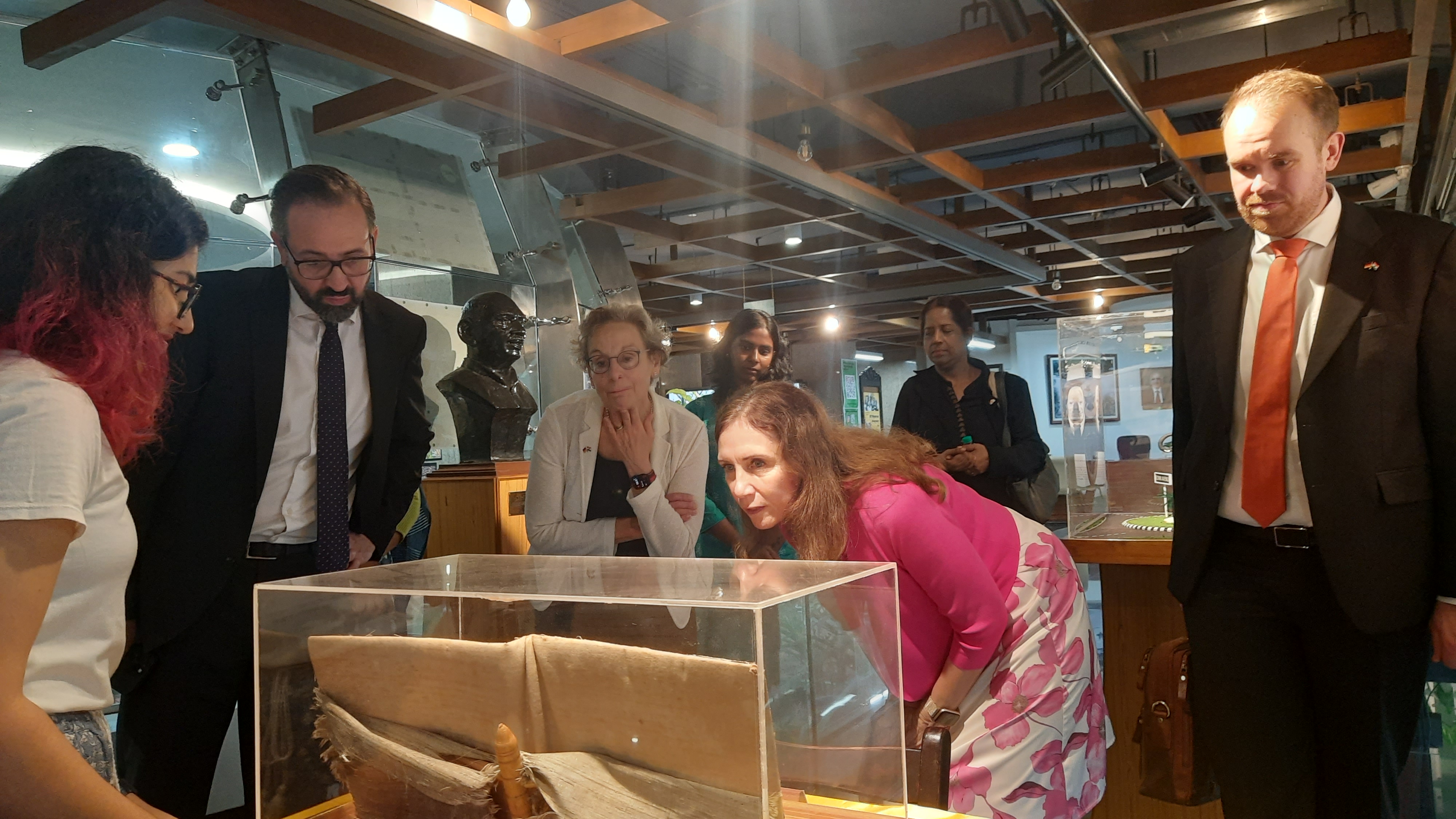 Mrs. Michaela Küchler (German Consul General) takes a look at the historic VIP autograph book