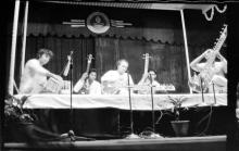 Pandit Ravishankar performing on stage with other musicians during Mardi Gras ’83