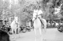 A man riding a horse in the campus during the cultural festival ’83