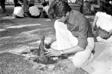 A student participating in a clay modelling event during Mardi Gras (1983)
