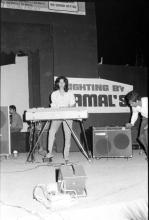 A student participating in a music event at Mardi Gras, 1983
