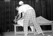 Participants performing in a skit during Mardi Gras (1983).