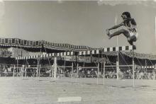 A student participates in a high jump event