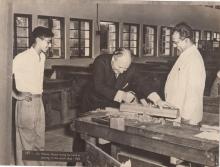 Mr. Walter Scheel trying his hand at planing in the workshop, 1963