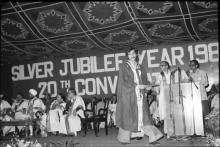 A graduand photographed at the podium after receiving his degree during the 20th convocation, 1983