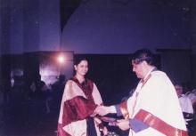 A student receives her degree from Prof. R. Natarajan, Director