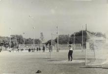 A student bowling while others look on 