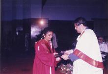 A student receives her degree from the Director, Prof. R. Natarajan