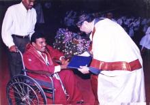 A student receives his degree from the Director, Prof. R. Natarajan