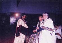 A student receives an award from chief guest, Jamshed J. Irani