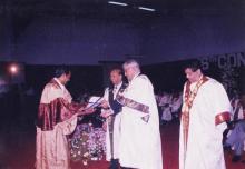 Mr. Jamshed J. Irani hands out and award to a student