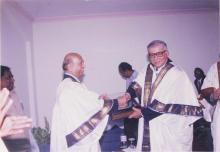 Mr. Jamshed J. Irani is greeted by the Chairman (probably)