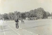 A student runs bearing a torch at the 13th Inter IIT Sports Meet