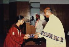 A student receives her degree from Dr. V. S. Arunachalam, 1988