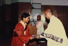 A student receives his degree during the 25th Convocation, 1988