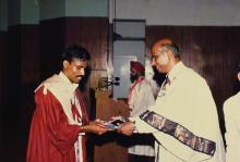 Dr. V. S. Arunachalam presents a degree at the 25th Convocation, 1988