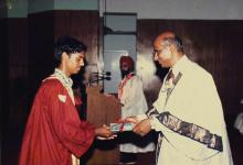 A graduand receives a degree from Dr. V. S. Arunachalam, 1988