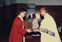 A student receives his degree during the 25th Convocation, 1988