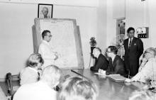 Prof. B. Sengupto explains the Institute map to the gathering, 1963