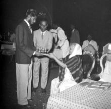 Mrs. Nirmala Medhi presents a prize to Mr. Syed Abdul Aleem, 1963