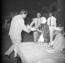 Mr. R. Natarajan receives a present from Mrs. Nirmala Medhi, 1963