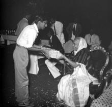 Mrs. Nirmala Medhi gives away a prize to a student during the Fourth Institute Day, 1963