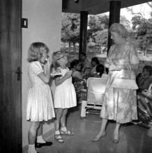 Mrs. Kraus interacts with young children, 1963