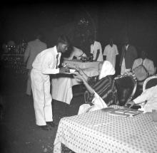 Mrs. Nirmala Medhi gives away a prize to a student during the Fourth Institute Day, 1963
