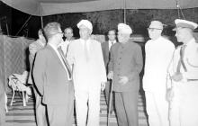 The dignitaries casually conversing with one another