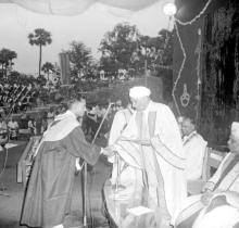 A student receives an award from Sir C. V. Raman