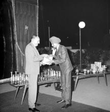 Dr. Karl Pfauter giving away a prize to a student at the Ninth Institute Day celebrations at the Open Air Theatre, 1968