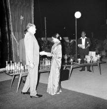 Dr. Karl Pfauter giving away a prize to a lady during the Ninth Institute Day celebrations at the Open Air Theatre, 1968