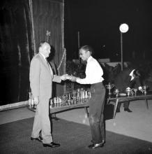 Dr. Karl Pfauter giving away a prize at the Ninth Institute Day celebrations at the Open Air Theatre, 1968