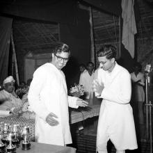 Mr. C. Subramaniam about to give away a prize to a student at the Second Institute Day, 1961