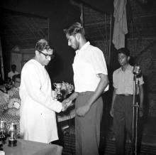 Mr. C. Subramaniam gives away a prize to Mr. Syed Abdul Aleem, 1961 