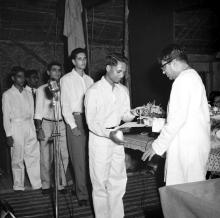 Mr. C. Subramaniam gives away a prize to Mr. Purushottam Ganpatrao Manusmare, 1961