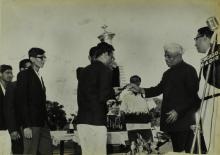 Students receiving a trophy from Dr. A. L. Mudaliar at the Third Inter-IIT Sports Meet, 1964