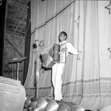 A student plays the accordion at the Second Institute Day, 1961