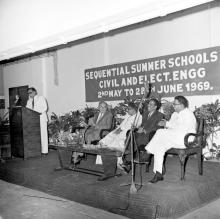 Dignitaries seated on the dias, from left, Dr. Pfauter, Dr. Karunanidhi, Prof. A. Ramachandran, Prof. Sampath