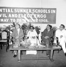 Dignitaries seated on the dias, from left, Dr. Pfauter, Dr. Karunanidhi, Prof. A. Ramachandran, Prof. Sampath